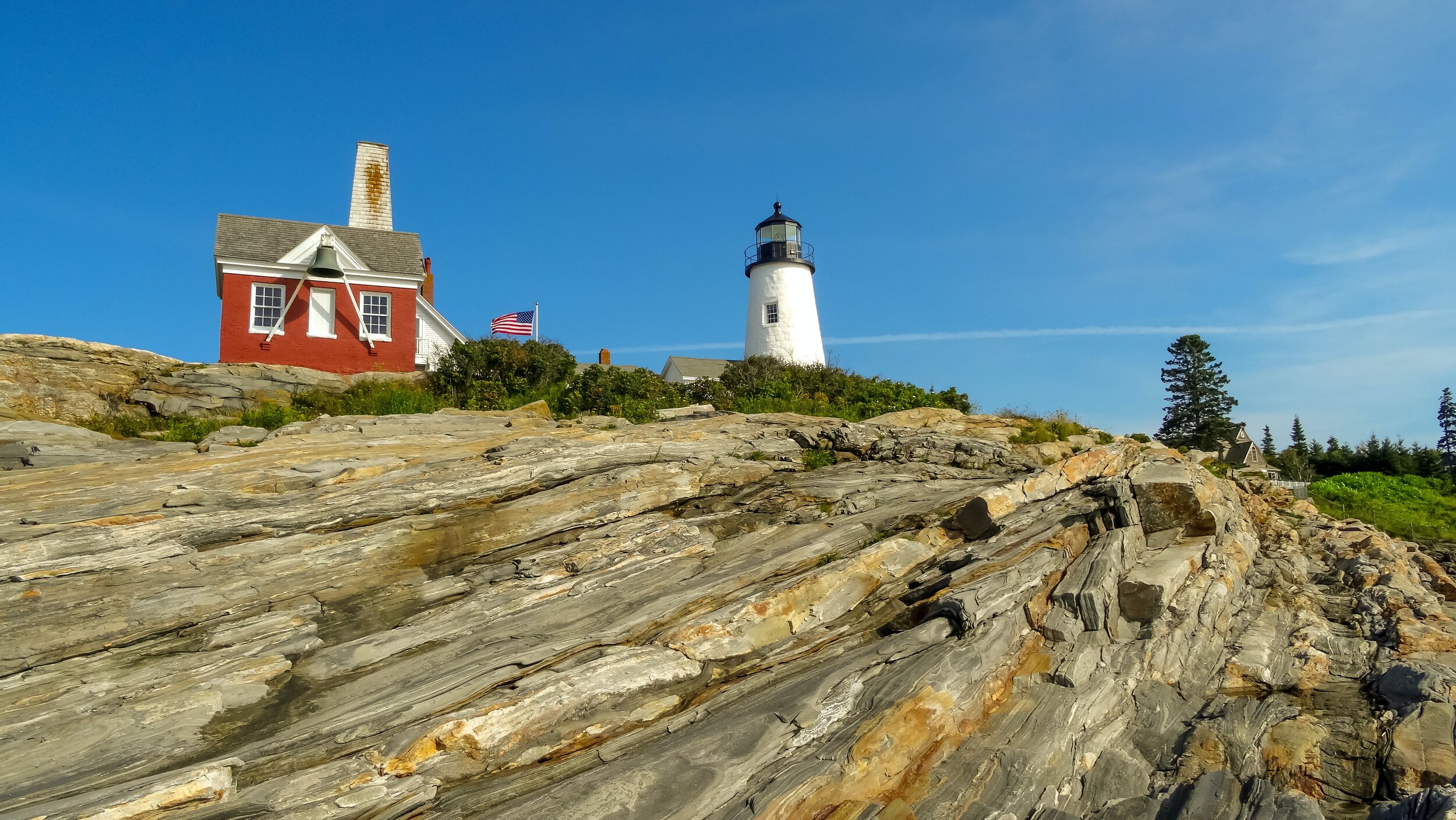 lighthouse with building with bell